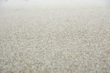 smooth sand surface of small white grains 