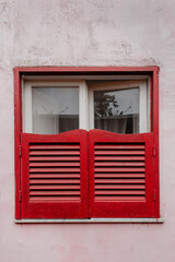 Old vintage wooden window with shutters. Travel concept. Traditional European old town building....