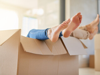 Couple, feet and moving in with box for new home, relocation or renovation in relax at apartment....