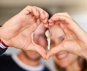 Happy couple, heart hands and new home with keys for love, apartment or investment together....