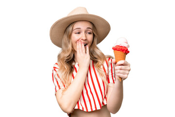 Young English woman with a cornet ice cream over isolated background with surprise and shocked facial expression