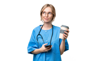 Young nurse English woman over isolated background holding coffee to take away and a mobile while thinking something