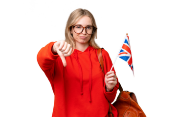Young hispanic woman holding an United Kingdom flag over isolated background showing thumb down with negative expression