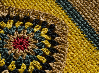 Raffia knitting texture close-up. Hand knitted zigzag jewelry.