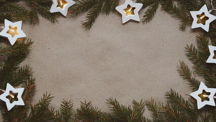 Christmas Frame With Pine Branches And Star Lights Warm Top View Kraft Background