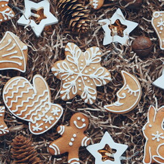 New Year's background with gingerbread. Christmas cookies and a garland on a craft background. Flat lay. Top View