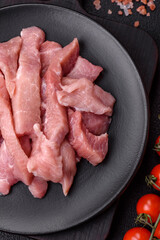 Slices of raw pork or turkey meat with salt, spices and herbs