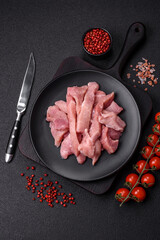 Slices of raw pork or turkey meat with salt, spices and herbs