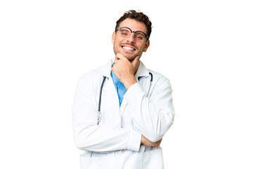 Brazilian doctor man over isolated chroma key background with glasses and smiling