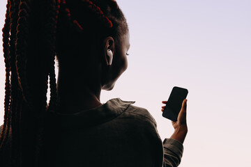 Young African woman using mobile phone for a video call