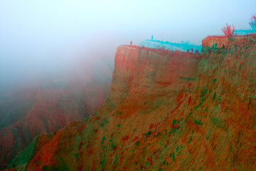 3d anagliph of sandstone cliffs on a foggy winter day.