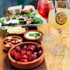 Mediterranean tapas spread with chorizo, cheese, salad, and sangria