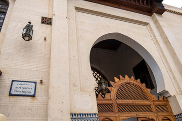 Seffarine square, street name tri lingual, arabic french and berber on ceramics panel. Fez medina old town, door detail of medersa Seffarine.
