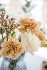 Decorative bouquet with carnations in a vase