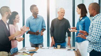Obraz premium Business people, architect and applause in meeting for success of building project with blueprint and diversity. Architecture, employees or collaboration with clapping hands in boardroom for proposal