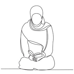 a Muslim woman reads a Koran