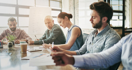 Business people, meeting and boardroom brainstorming with paperwork or financial statistics, collaboration or strategy. Men, women and conference room planning at startup office, document or review