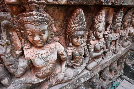 Angkor Wat, Cambodia - February 14, 2019: Buddhist stone carvings in Ta Prohm temple.