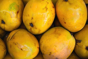 Ataulfo Mangoes: Fresh and Organic Tropical Fruit Pile on Yellow Background - Sweet, Healthy