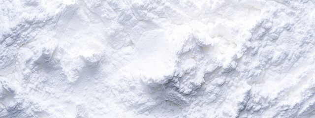 Fototapeta premium Blurred white flour background. Flour texture. Top view. Copy space.