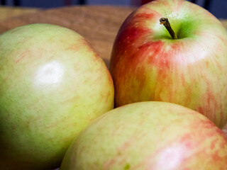 Ripe Apples Display. A group of apples with a vibrant skin texture, ideal for food and health-related imagery.