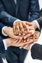 Obraz premium Business people, hands and stack for teamwork support or corporate community, partnership or solidarity. Colleagues, pile and target goals with company trust as workforce, connection or opportunity