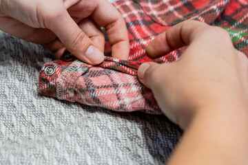 Woman hemming with sewing machine. Sewing, hobby, home improvement.