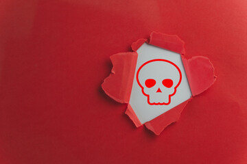 Skull icon in Red paper hold use to Mortality and Human Anatomy,Danger and Warning,Attention,hazard signs, cautionary labels, or safety warnings to alert individuals to potential risks or threats.