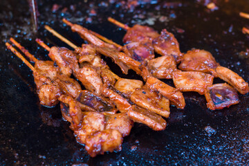 Squid satay grilled at a culinary festival