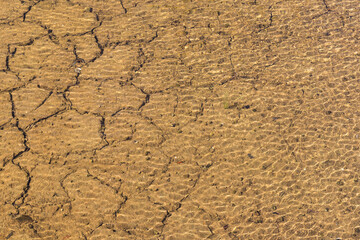 Water though the cracks on the drought land