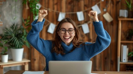 Woman Celebrating Success at Desk