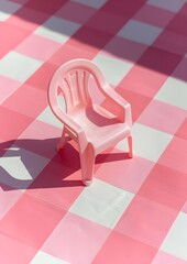 
Plastic garden chair on a checkered background, retro style, fifties, nostalgia, pink aesthetic