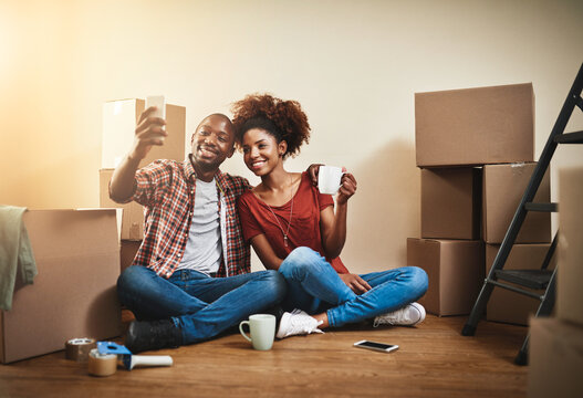 Moving, selfie and couple in home with phone for social media, memory and relax in apartment. Happy, people and video call in new house with smartphone and smile for real estate, property and rent