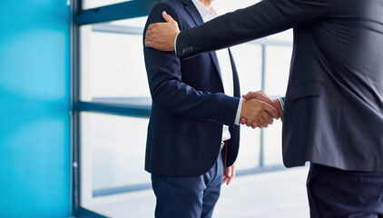 Business men, shaking hands and collaboration in office with agreement, deal or partnership. Greeting, welcome and onboarding at corporate company with professional contract and thank you at law firm