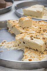 Halva with nuts on stall at bazaar. High calorie snack