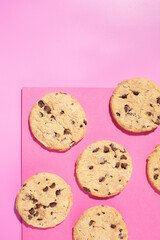 Fresh cookies with chocolate chips on a pink background. Dessert, a pastry shop.
