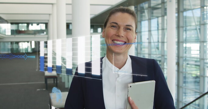 Image of financial data processing over caucasian businesswoman with tablet
