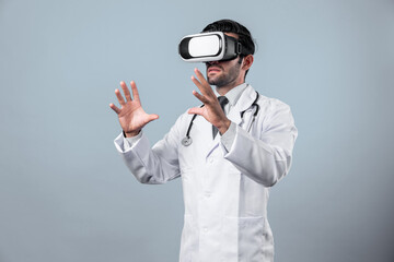 Smart doctor looking VR glass and standing with white background. Caucasian doctor holding and...