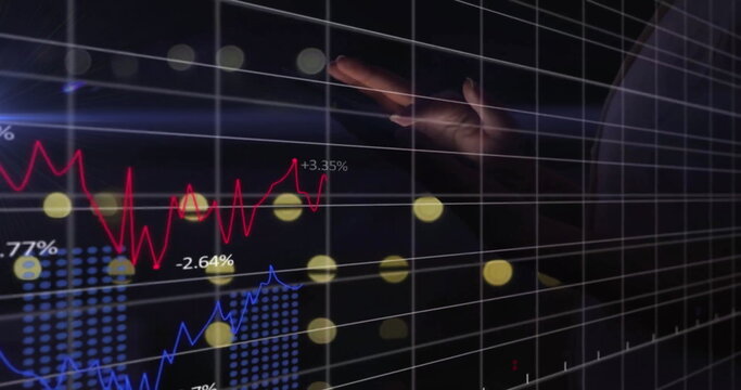 Image of financial data processing over hand of caucasian businesswoman using tablet