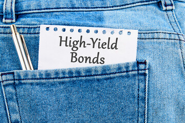 Inscription High-Yield Bonds on a piece of paper that appeared from the pocket of jeans