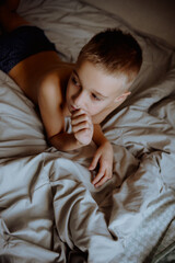 child sleeping in bed