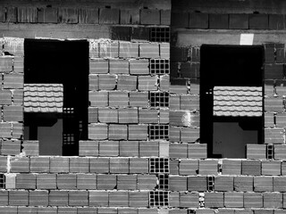 Emerging Dimensions. Construction in Light and Shadow. Brick wall, background. Windows frames. Eyes...