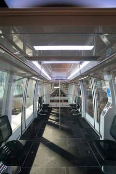 DOHA, QATAR - OCTOBER 13, 2023: interior shot of Hamad International Airport glass-roofed passenger train.