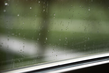 raindrops on window, rainy season background