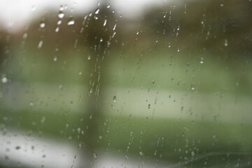 raindrops on window, rainy season background