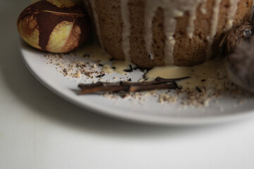easter cake with chocolate and eggs on a white plate