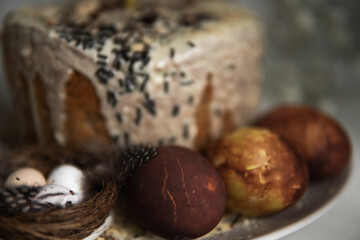 easter cake with chocolate and eggs on a white plate