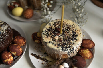 easter cake with chocolate and eggs on a white plate