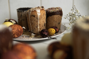 easter cake with chocolate and eggs on a white plate