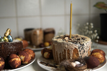 easter cake with chocolate and eggs on a white plate
